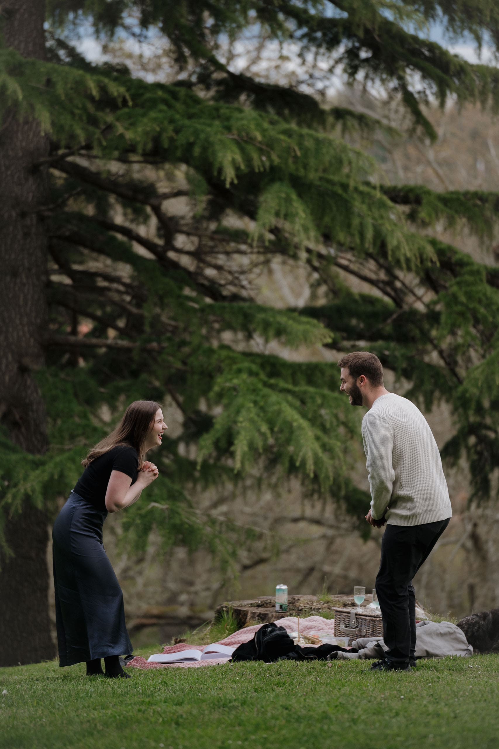 Victoria BC proposal photographer captures the excitement and laughter of a newly engaged couple after their surprise proposal at Government House on Vancouver Island.