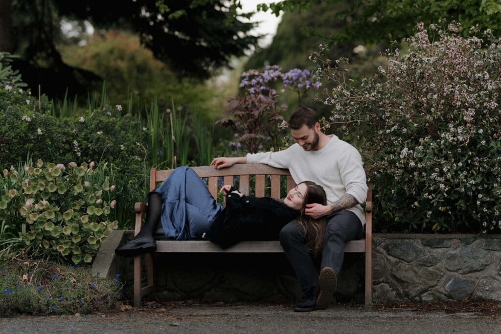 Couple enjoying each other at Government House Victoria gardens golden hour after surprise proposal