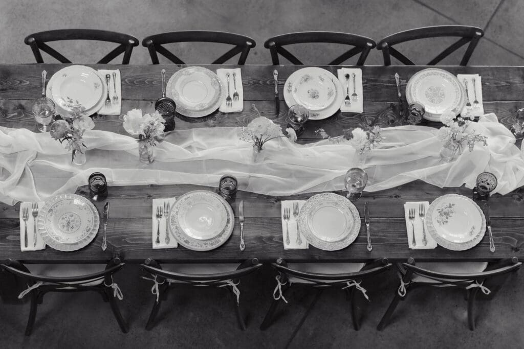A black & white image of a dinner set up at Wildflower on Watts in Honesdale PA