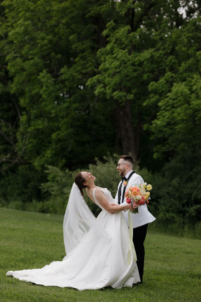 A bride and groom laugh between tears during their emotional first look at Wildflower on Watts in Honesdale PA.