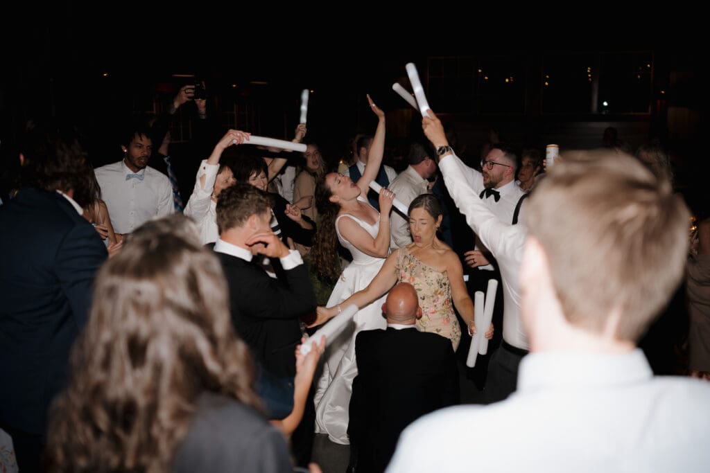 The dance floor party at a wedding reception held at Wildflower on Watts in Honesdale PA. Captured by Victoria BC travel wedding photographer Hayley Zumkeller.