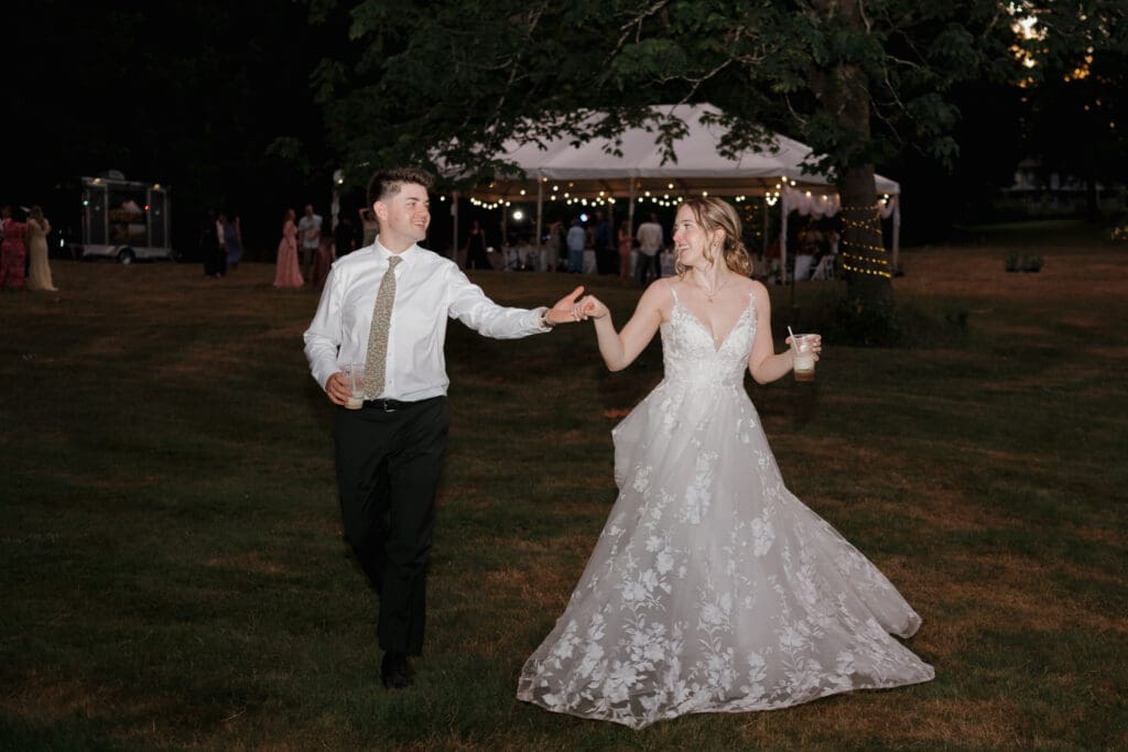 A bride and groom end the night with a last dance during their outdoor wedding ceremony in Nanaimo BC. This image captured by Hayley Zumkeller's Vancouver Island Wedding Videography team from Victoria BC.