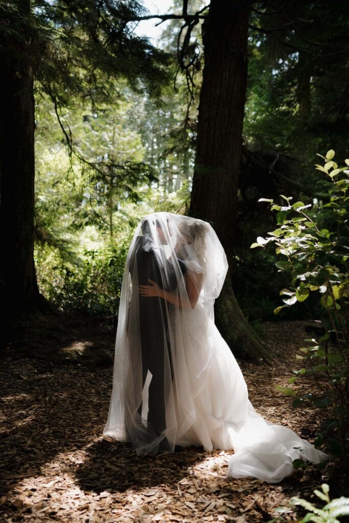Romantic bride and groom wedding portraits in the Tofino rainforest on Vancouver Island