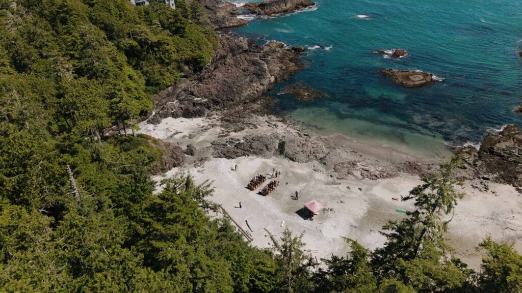 Aerial view of a private beach wedding ceremony at the Wickaninnish Inn on Vancouver Island