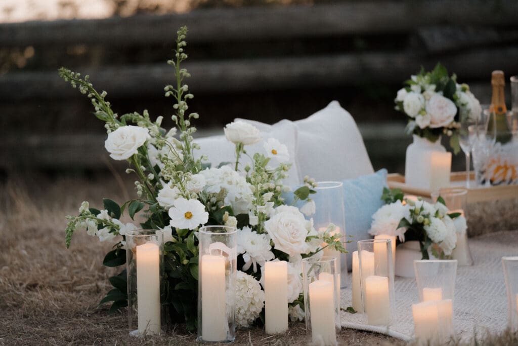 Candles and florals arranged for a private evening proposal in Victoria BC along Dallas Road