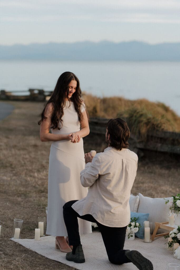 Newly engaged couple laughing together after a candlelit proposal, Victoria BC