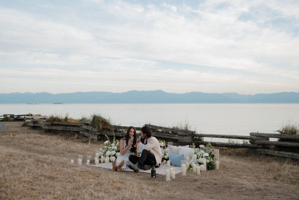 Surprise Proposal Planner Hayley Zumkeller sets up luxury picnic proposal along Dallas Road Oceanfront in Victoria BC for couple