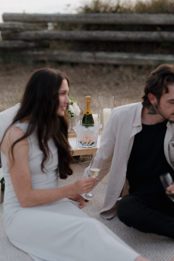 Surprise Proposal Planner Hayley Zumkeller sets up luxury picnic proposal along Dallas Road Oceanfront in Victoria BC for couple