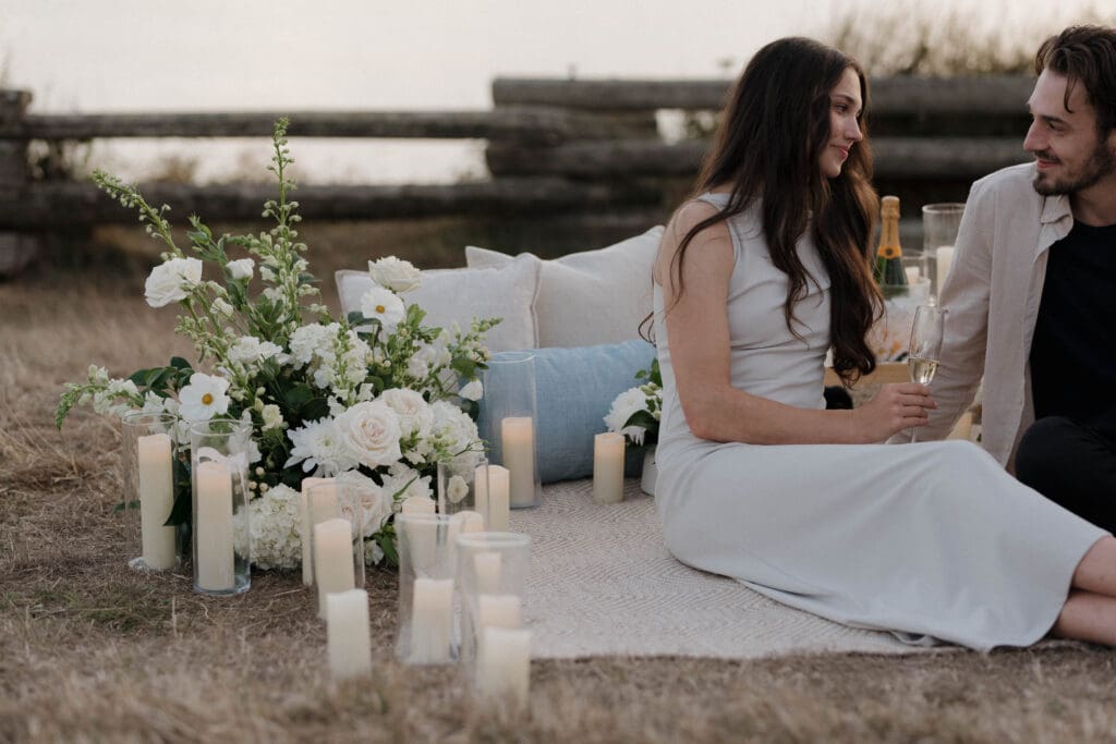 Candles and florals arranged for a private evening proposal in Victoria BC along Dallas Road
